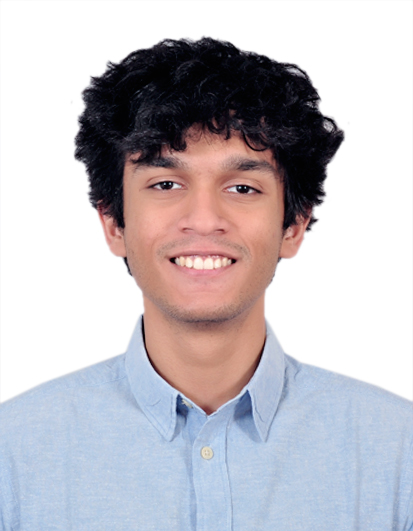 A picture of Abhishek Dhadwal, shown wearing a blue shirt on a white background.